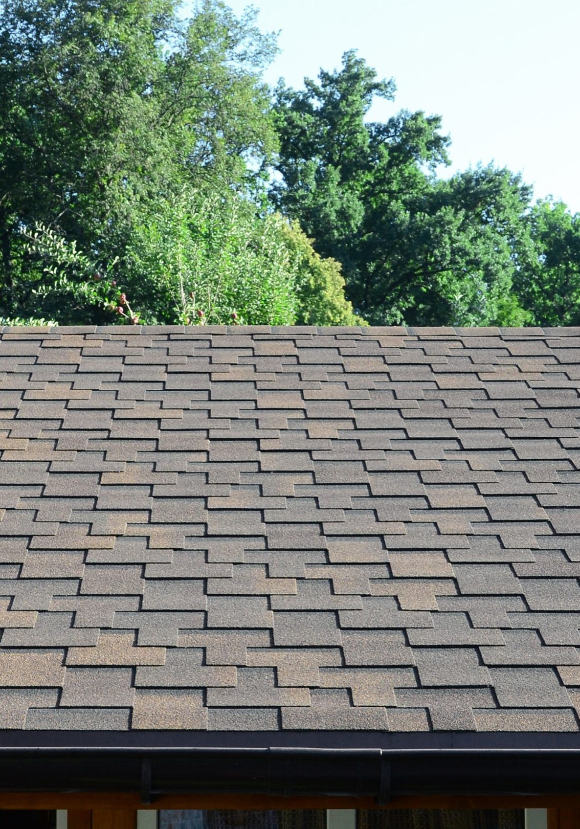 Modern roofing and decoration of chimneys. Flexible bitumen or slate shingles in rectangular shape in perspective.